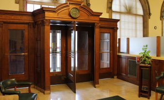 Front door airlock woodwork and wood revolving door